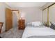 Comfortable bedroom with neutral walls, plush carpet, and a cozy bed with soft, white pillows at 2296 S Pitkin Way # A, Aurora, CO 80013