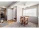 Bright dining area featuring a ceiling fan and a window view, next to the entry way at 2296 S Pitkin Way # A, Aurora, CO 80013