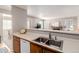 Open kitchen design featuring a double basin stainless steel sink with wooden cabinets at 2296 S Pitkin Way # A, Aurora, CO 80013