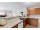 Open-concept kitchen with double basin sink, and a partial view to the living room at 2296 S Pitkin Way # A, Aurora, CO 80013