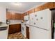 Practical kitchen featuring white appliances and ample wood-tone cabinet storage at 2296 S Pitkin Way # A, Aurora, CO 80013