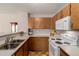 Functional kitchen equipped with essential appliances and ample cabinet space at 2296 S Pitkin Way # A, Aurora, CO 80013