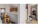 This charming kitchen boasts wooden cabinets, a breakfast bar, and a view into the hallway at 2296 S Pitkin Way # A, Aurora, CO 80013