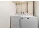 Bright laundry area with a white washer and dryer, providing convenience and functionality at 2296 S Pitkin Way # A, Aurora, CO 80013