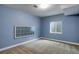 Unfinished basement featuring small windows and blue walls, ready to be transformed into personalized living space at 602 Mathews Way, Erie, CO 80516