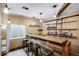Finished basement featuring a custom bar with wood accents and rustic shelving at 602 Mathews Way, Erie, CO 80516