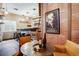 Finished basement offers a cozy bar area with brick accents and unique decor at 602 Mathews Way, Erie, CO 80516