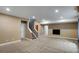 Finished basement area with carpeting, recessed lighting, and staircase, offering flexible living space for various activities at 602 Mathews Way, Erie, CO 80516