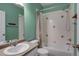 Clean and functional bathroom with a tiled shower-tub, toilet, and vanity sink with a mirror for personal care at 602 Mathews Way, Erie, CO 80516