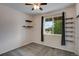 Clean bedroom features built in wall shelving and a bright window with neighborhood views at 602 Mathews Way, Erie, CO 80516