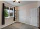 A cozy bedroom with a ceiling fan, carpeted floor, a window, and a closet, offering a comfortable and functional space at 602 Mathews Way, Erie, CO 80516