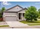Charming single-Gathering home featuring a two-car garage, manicured lawn, and inviting curb appeal at 602 Mathews Way, Erie, CO 80516