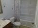 A clean bathroom featuring a shower-tub combo and neutral decor at 10792 E Exposition Ave Ave # 254, Aurora, CO 80012