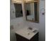 A small bathroom with a sink and mirror at 10792 E Exposition Ave Ave # 254, Aurora, CO 80012
