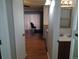 Bathroom and view of living room at 10792 E Exposition Ave Ave # 254, Aurora, CO 80012