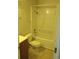 Bathroom features white tile shower-tub combo at 10792 E Exposition Ave Ave # 254, Aurora, CO 80012