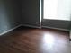 Bedroom featuring hard surface floors and a bright window at 10792 E Exposition Ave Ave # 254, Aurora, CO 80012