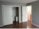Bedroom with white door and closets at 10792 E Exposition Ave Ave # 254, Aurora, CO 80012
