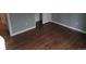 Neutral bedroom featuring wood floors and white trim at 10792 E Exposition Ave Ave # 254, Aurora, CO 80012