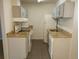 A functional kitchen with modern appliances, granite countertops and grey cabinets at 10792 E Exposition Ave Ave # 254, Aurora, CO 80012