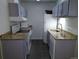 A functional kitchen with modern appliances, granite countertops and grey cabinets at 10792 E Exposition Ave Ave # 254, Aurora, CO 80012