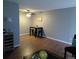 Living room and dining area with modern ceiling fan and hardwood flooring at 10792 E Exposition Ave Ave # 254, Aurora, CO 80012