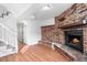 Basement boasting a brick fireplace, vinyl plank flooring, and access to additional rooms at 5721 W 92Nd Ave # 52, Westminster, CO 80031