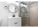 Modern bathroom features a glass-enclosed shower, updated vanity, and stylish fixtures at 5721 W 92Nd Ave # 52, Westminster, CO 80031