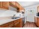 Functional kitchen showcasing wooden cabinets, stainless steel appliances, and plenty of counter space at 5721 W 92Nd Ave # 52, Westminster, CO 80031