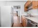 Open kitchen showcasing stainless steel appliances and a view into the spacious living room at 5721 W 92Nd Ave # 52, Westminster, CO 80031