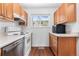 Functional kitchen with wooden cabinets and standard appliances at 5721 W 92Nd Ave # 52, Westminster, CO 80031