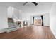 Spacious living room with staircase, wood floors, and bright french doors at 5721 W 92Nd Ave # 52, Westminster, CO 80031