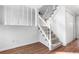 Carpeted staircase with white railings and trim, leading to the upper level of the home at 5721 W 92Nd Ave # 52, Westminster, CO 80031