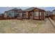 Spacious backyard with grass, gravel, and a back deck at 7809 Bandit Dr, Castle Rock, CO 80108