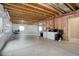 Unfinished basement with exposed beams and wrapped walls, offering potential for customization and expansion at 7809 Bandit Dr, Castle Rock, CO 80108