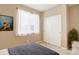 Bright bedroom with a modern window and view featuring a closet and dresser at 7809 Bandit Dr, Castle Rock, CO 80108