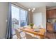 Cozy dining area with wood table and chairs, adjacent to sliding glass doors for natural light at 7809 Bandit Dr, Castle Rock, CO 80108