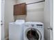 Functional laundry room featuring a washer, dryer, and cabinet space at 7809 Bandit Dr, Castle Rock, CO 80108