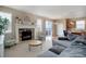 Comfortable living room features a fireplace, stylish furnishings, and an open layout at 7809 Bandit Dr, Castle Rock, CO 80108