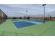 Well-maintained community tennis courts with vibrant blue and green surfaces, perfect for active recreation at 7809 Bandit Dr, Castle Rock, CO 80108
