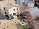 An aerial view showcases the property's backyard with patio, landscaping, and proximity to neighboring homes at 2755 Geneva St, Denver, CO 80238