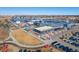 Aerial view of the Stanley Marketplace, featuring outdoor seating, parking, and surrounding community at 2755 Geneva St, Denver, CO 80238