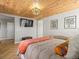 Bright bedroom featuring vaulted wood ceilings, herringbone floors, and modern decor at 2755 Geneva St, Denver, CO 80238
