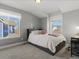 Cozy bedroom featuring plush carpet, neutral colors, and bright windows at 2755 Geneva St, Denver, CO 80238
