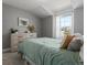 Neutral bedroom featuring plush carpet, natural light, and tasteful decor at 2755 Geneva St, Denver, CO 80238