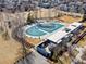Aerial view of a community pool area, featuring a unique design and ample space for recreation at 2755 Geneva St, Denver, CO 80238