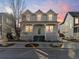 Charming two-story home featuring a cozy front porch and landscaped front yard perfect for enjoying neighborhood views at 2755 Geneva St, Denver, CO 80238