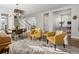Bright living room showcases a stylish chandelier, comfortable seating, and an open floor plan at 2755 Geneva St, Denver, CO 80238