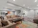 Basement Gathering room with sectional sofa, recessed lighting, and wet bar at 2755 Geneva St, Denver, CO 80238