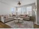 Bright living room with large windows, comfortable sectional sofa, and stylish decor at 2755 Geneva St, Denver, CO 80238